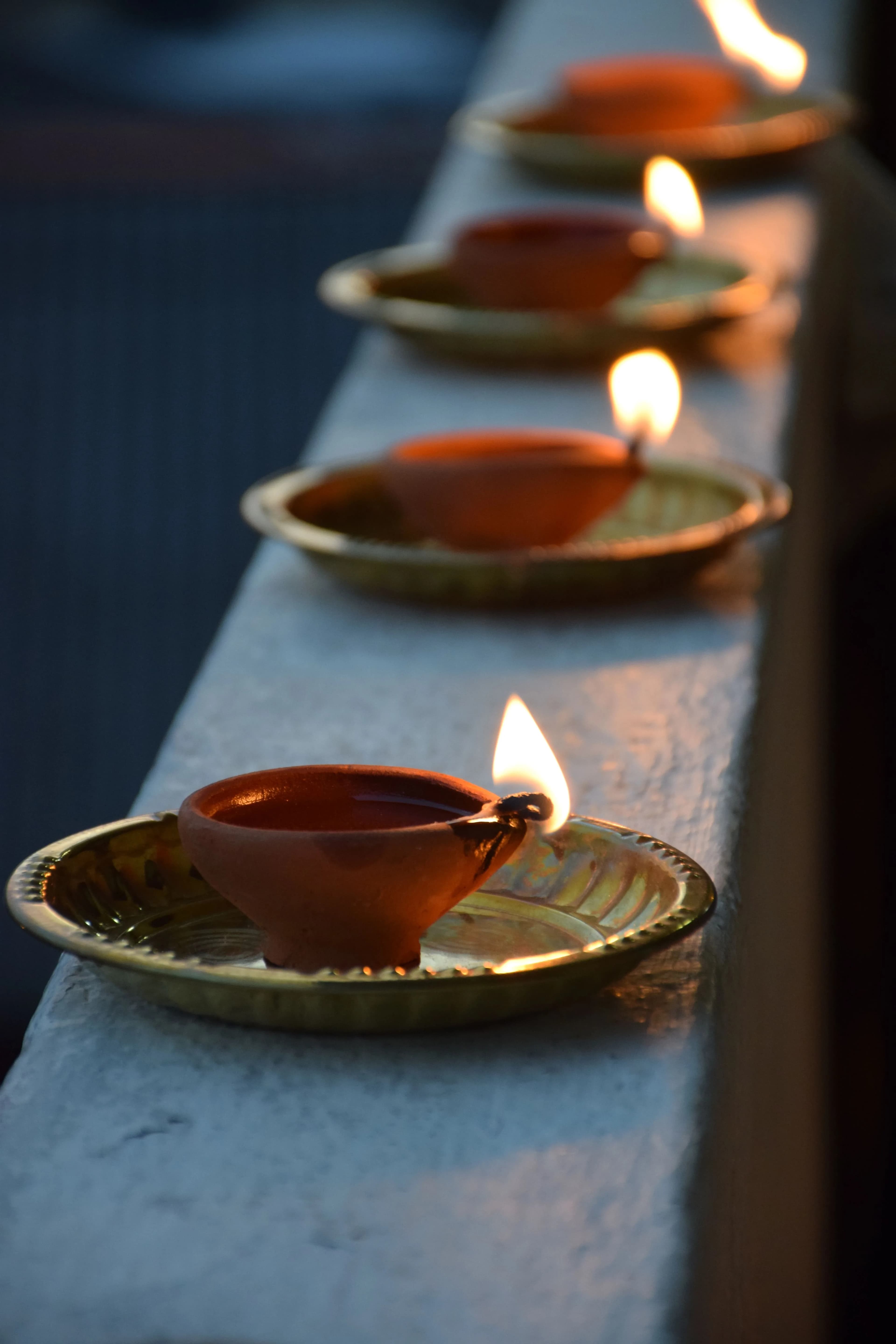 Lit clay diyas glowing for Diwali